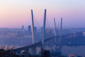 The Golden Bridge in Vladivostok over the Golden Horn Bay. Cable-stayed bridge at dawn. Panoramic...