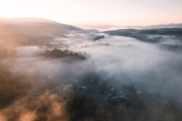 Flying above the clouds sunrise and fog