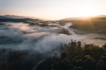 Flying above the clouds sunrise and fog
