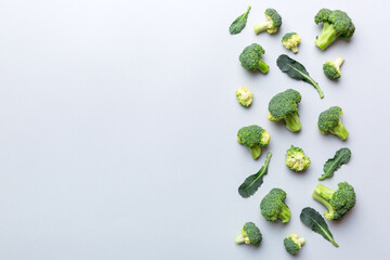 Top view fresh green broccoli vegetable on Colored background. Broccoli cabbage head Healthy or vegetarian food concept. Flat lay. Copy space