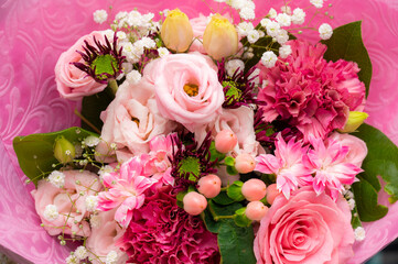 A pink bouquet of flowers for a gift or event background.