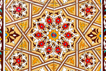 traditional Uzbek pattern on the ceramic tile on the wall of the mosque, abstract background