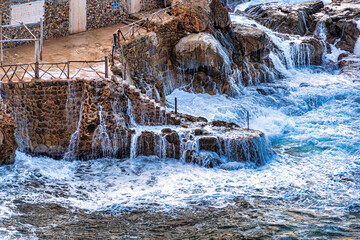 strong waves against old pier, climate change, mallorca, Spain