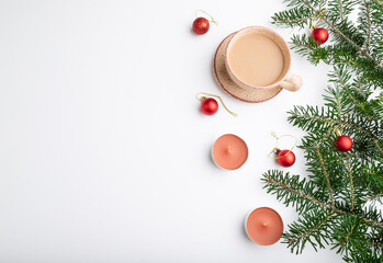 Christmas or New Year composition. Decorations, red balls, fir and spruce branches, on a white background. Top view, copy space.