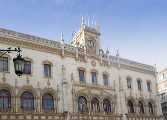 Fototapeta na wymiar Ornate architecture in Lisbon capital of Portugal.Rossio train station,old Portuguese building facade