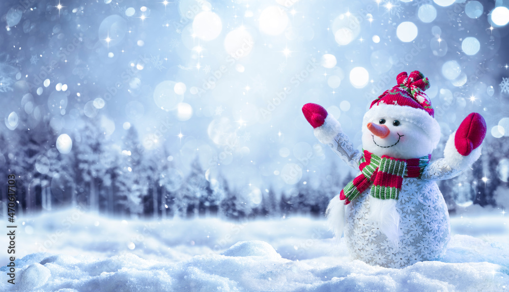Canvas Prints snowman on snow in forest with snowfall in defocused landscape