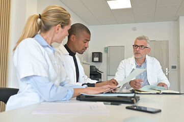 Medical team meeting in hospital room