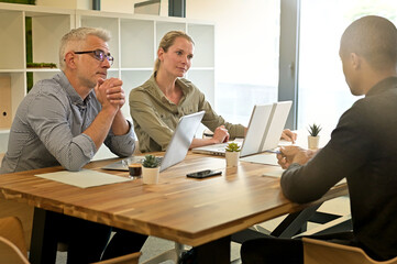 Business people in modern meeting room working together on project