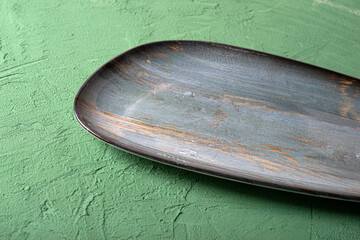 Modern clay dish on a solid background