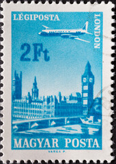 HUNGARY - CIRCA 1966: A post stamp printed in Hungary showing an Ilyushin II-18 Plane over the City of London Served by Hungarian Airways