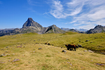 View of a mountain landscape with a cloudy sky. Pic du Midi d'Ossau