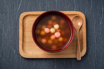 Red and white tangyuan with syrup soup.