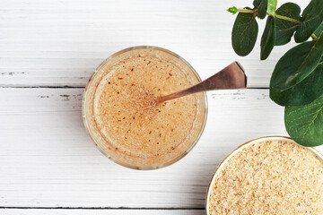 Psyllium husk mixed with water and consumed to treat constipation. View from above
