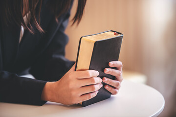 Portrait of a woman with bible prayers, spirituality and religion concepts.
