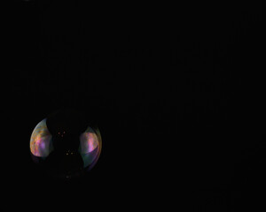 soap bubbles on a black background