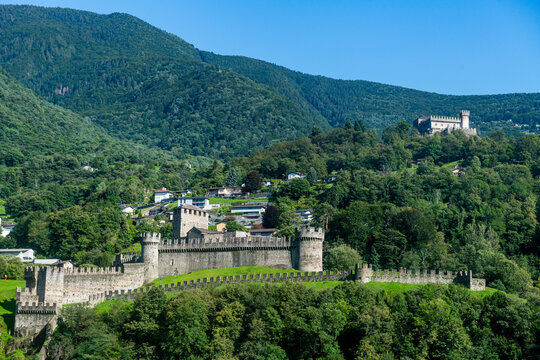 Switzerland, Ticino, Bellinzona, Montebello castle with green forested mountains in background