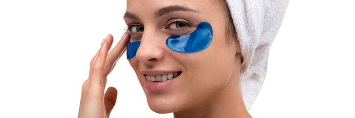 beautiful woman with blue patches on the face skin care around the eyes, cosmetic procedures
