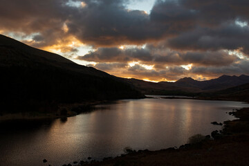 Llynnau Mymbyr at sunset with clouds reflected on the water.  Part of the Snowdonia National Park in Wales