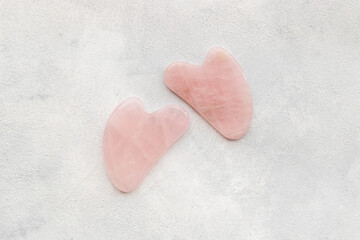 Fototapeta premium Pink chinese gua sha massage stone for lifting face and wellness