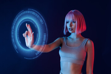 Woman in modern VR glasses interacting with network while having virtual reality experience. Augmented reality game, future technology, AI concept. VR. Holographic interface to display data.