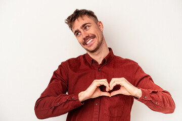 Young caucasian man isolated on white background standing with outstretched hand showing stop sign, preventing you.