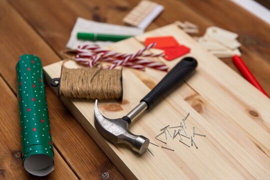winter holidays, diy and hobby concept - close up of decorative stuff and work tools for christmas advent calendar making