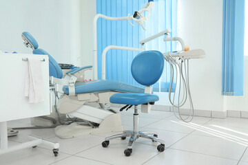 Dentist's office interior with chair and modern equipment