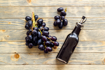 Balsamic vinegar with bunch of fresh grapes