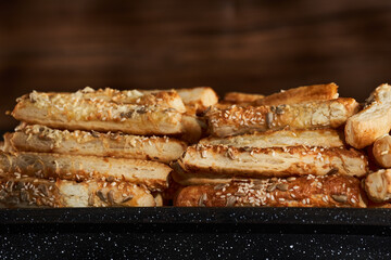 Pastry crackers with sesame seeds and cheese