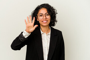 Young latin business woman isolated on white background smiling cheerful showing number five with fingers.