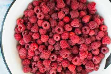 Raspberries background. Fresh red berries of ripe raspberries	