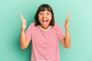 Young mixed race woman isolated on blue Young mixed race woman isolated on blue background relaxed and happy laughing, neck stretched showing teeth.