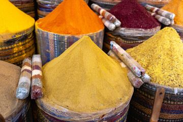 Spice and seasonings in market. Colorful spice and exotic herbs on display in spice bazaar in...