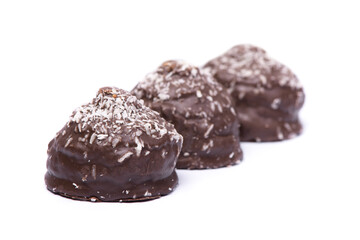 Group of chocolate glazed cakes with coconut chips