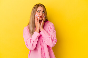 Young russian woman isolated on yellow background whining and crying disconsolately.