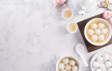 Fototapeta na wymiar Top view of Tang Yuan(sweet dumplings balls) on stone background. Traditional cuisine for lantern festival, Mid-autumn, Dongzhi (winter solstice festival) and Chinese new year.