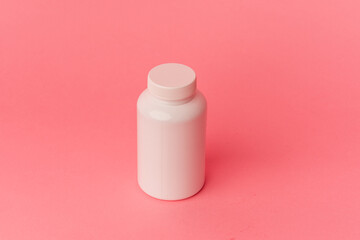 Pills isolated on pink background