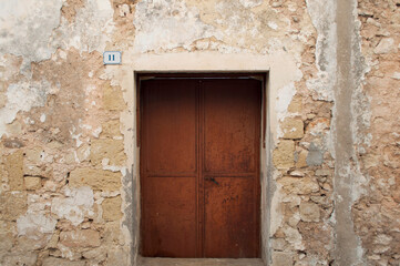 Fototapeta na wymiar Old Rusty Door. Salento, Italy