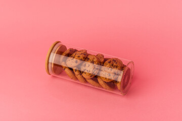 Cookies jar isolated on pink background