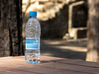 bottle of mineral water on wooden table   