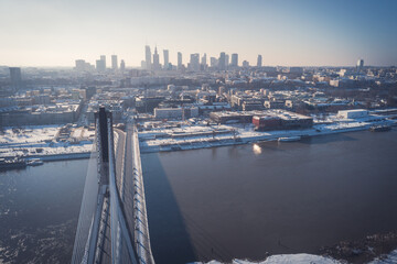 Swietokrzyski bridge over Vistula river and Warsaw city center aerial winter landscape