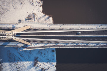 Car on a bridge, aerial top down winter perspective