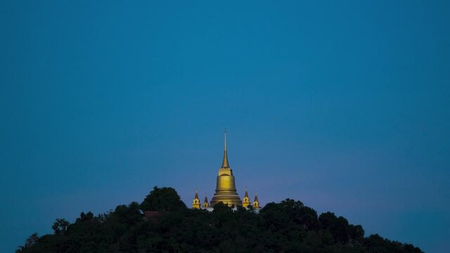 Pagoda Khao Hua Jook, the fullmoon move over Golden pagoda with warm cloud , twilight sky to moon night sky at Chaweng , Koh samui , suratthani , thailand	
