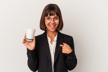 Young mixed race business woman holding a coffee isolated on white background person pointing by hand to a shirt copy space, proud and confident