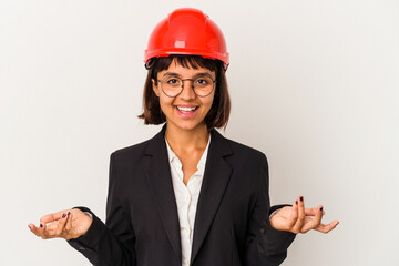 Young architect woman with red helmet isolated on white background showing a welcome expression.