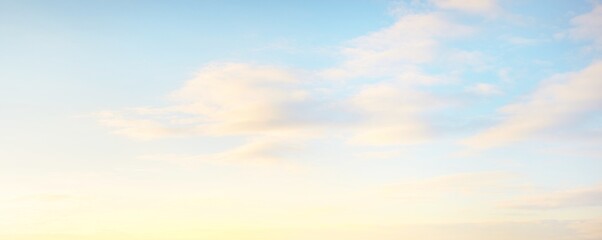 Clear sky, glowing cirrus and cumulus clouds after the storm, soft sunlight. Dramatic sunset...