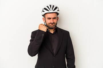 Young business bald man wearing a bike helmet isolated on white background  showing fist to camera, aggressive facial expression.