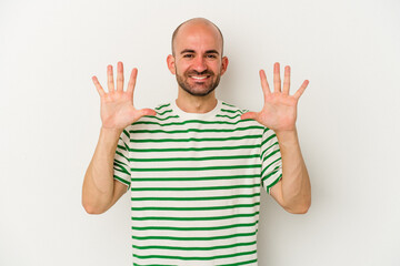 Young bald man isolated on white background showing number ten with hands.