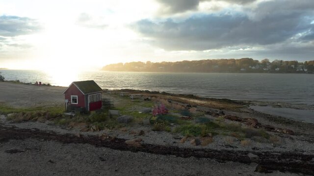 Stunning aerial shot of a shack on the coast of Harpswell, Maine.