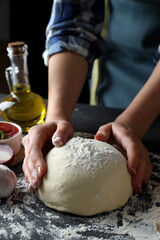 Fototapeta premium Concept of cooking pizza on dark textured table